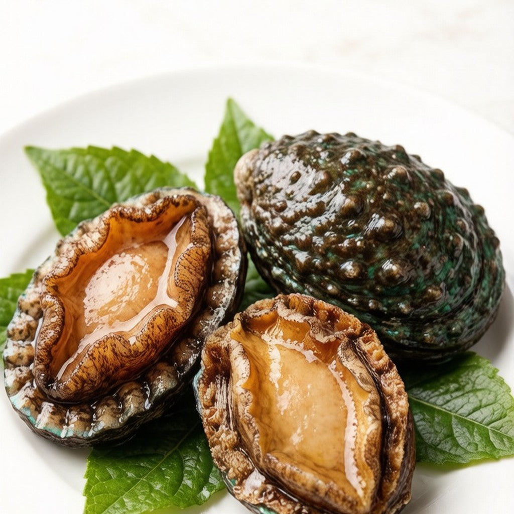 Thinly sliced abalone arranged on crushed ice with wasabi